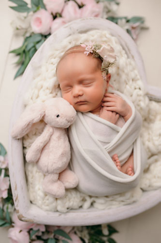 baby in heart prop photographed in Preston photography studio
