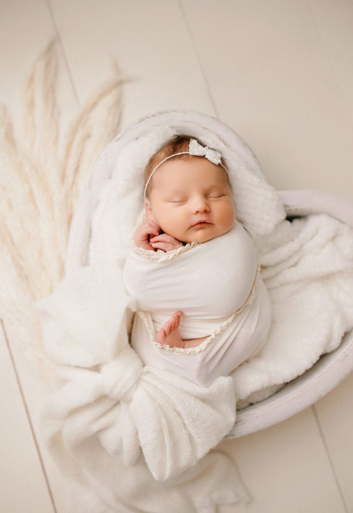 newborn photoshoot preston, baby wrapped up in natural colours, timeless photography