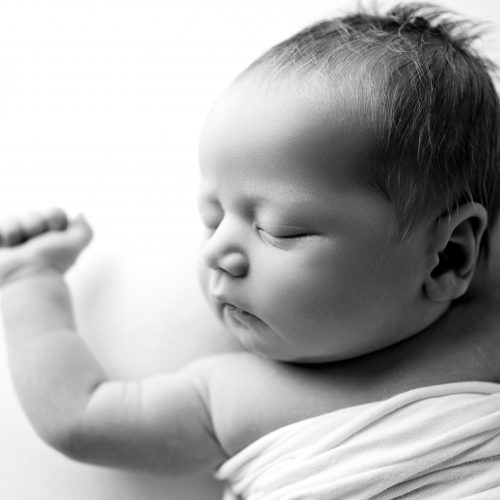 Newborn photoshoot, baby on the white background, natural poses