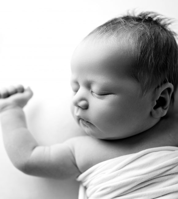Newborn photoshoot, baby on the white background, natural poses