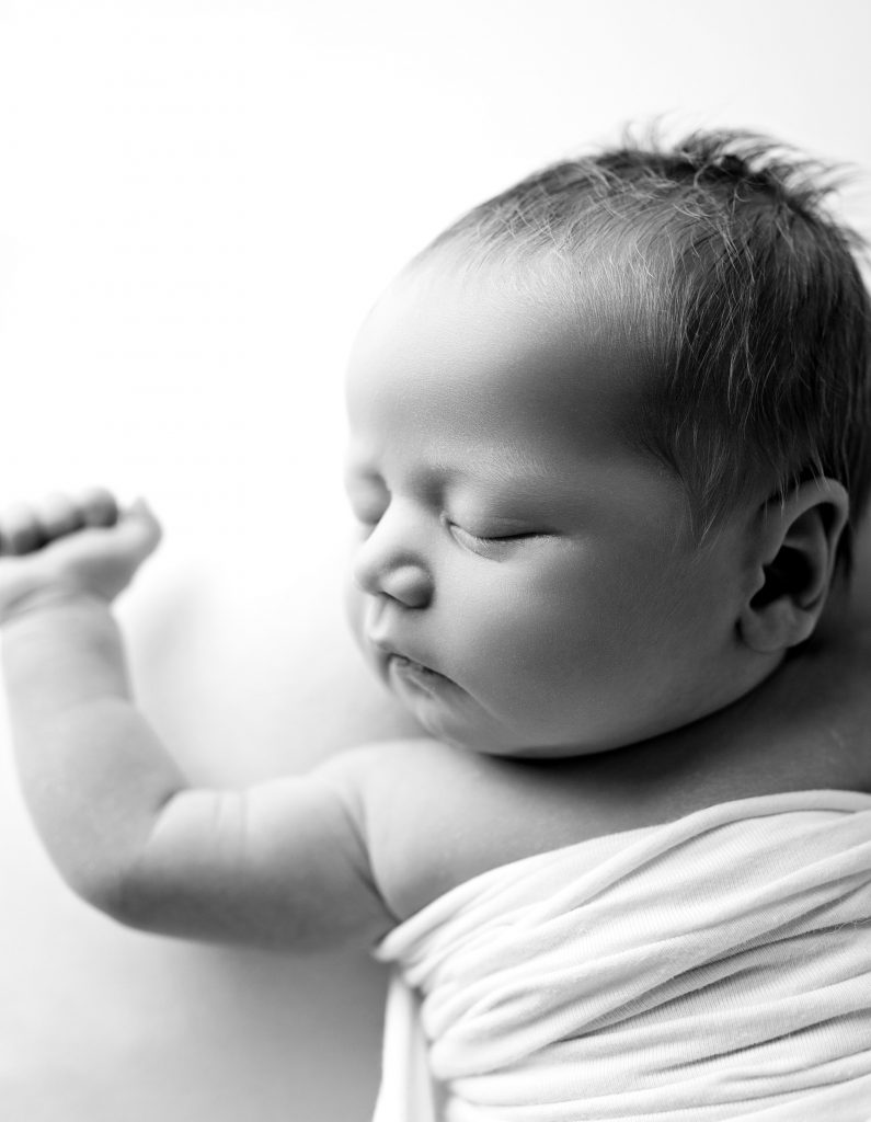 Newborn photoshoot, baby on the white background, natural poses